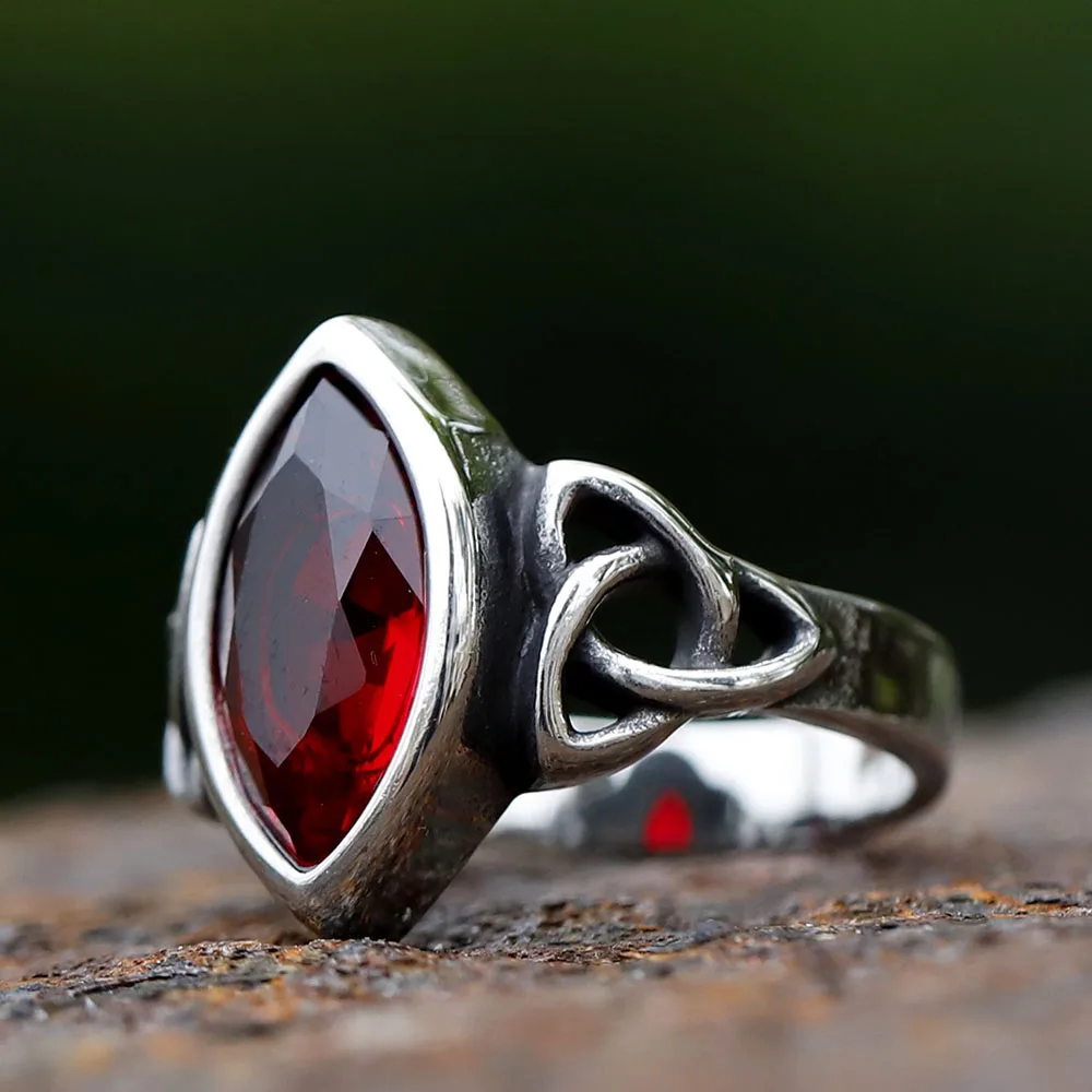 Celtic knot ring with red stone