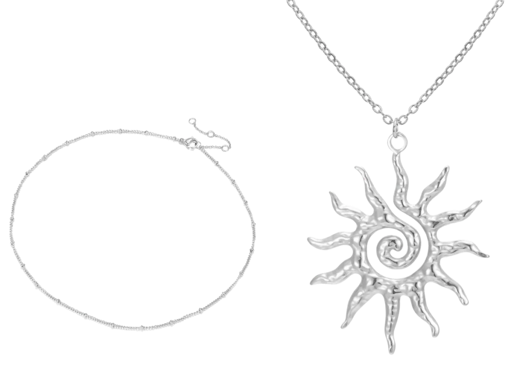 A satellite chain beside a spiral sun pendant on its chain, in stainless steel
