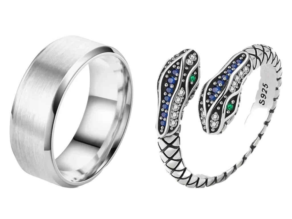 A brushed stainless steel band beside a sterling silver snake ring