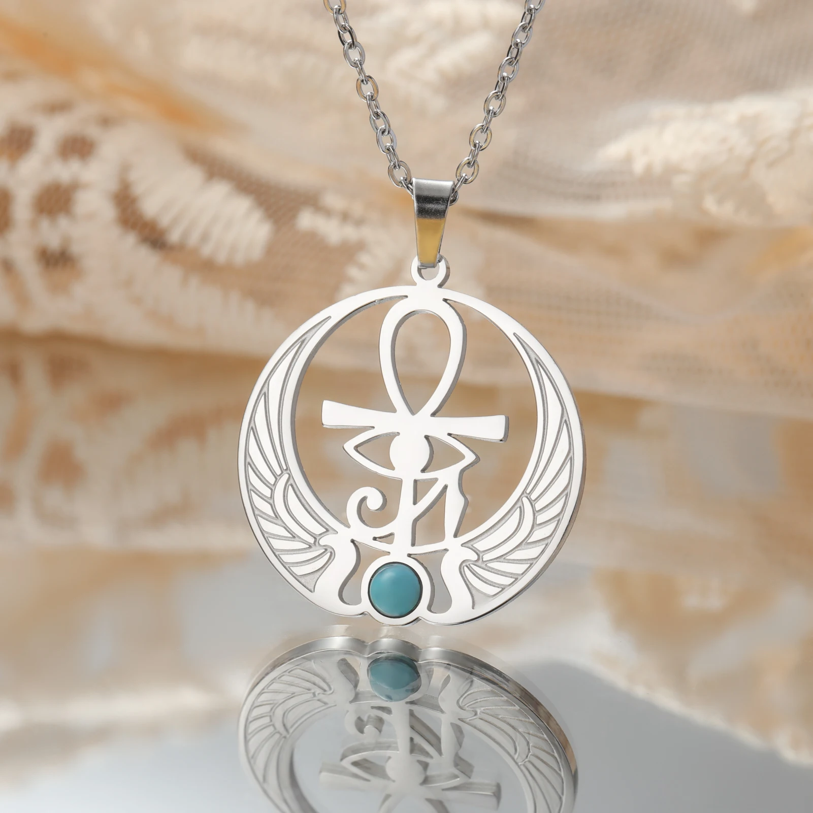 Winged ankh pendant with blue stone